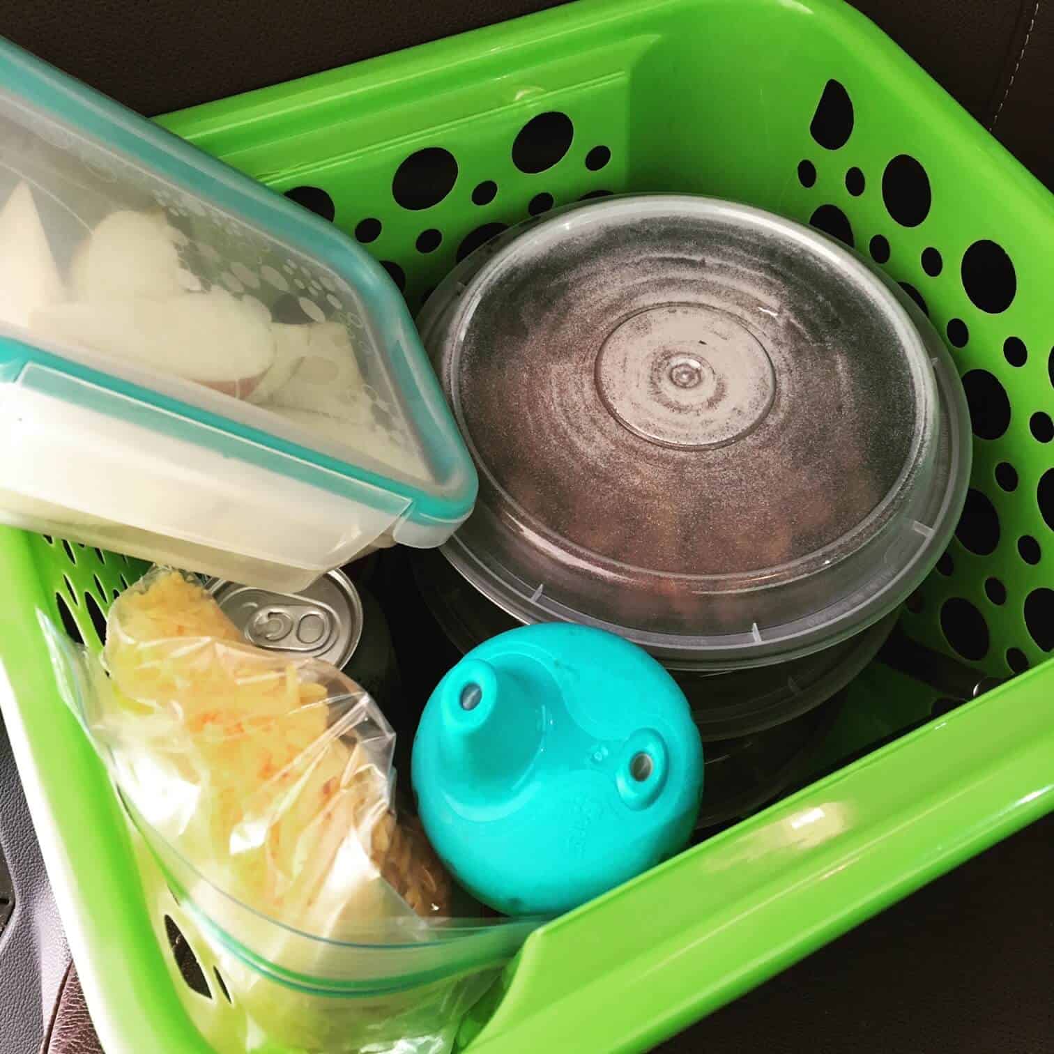 A packed basket of on the go field meal items.
