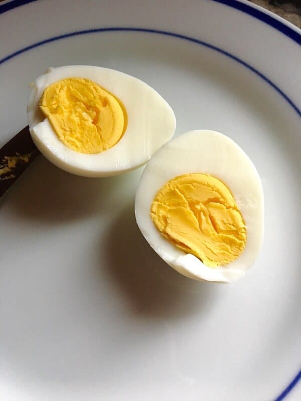 A hard boiled egg cut in half.