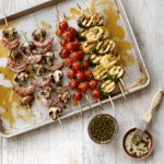 Veggie kabobs on a sheet pan.
