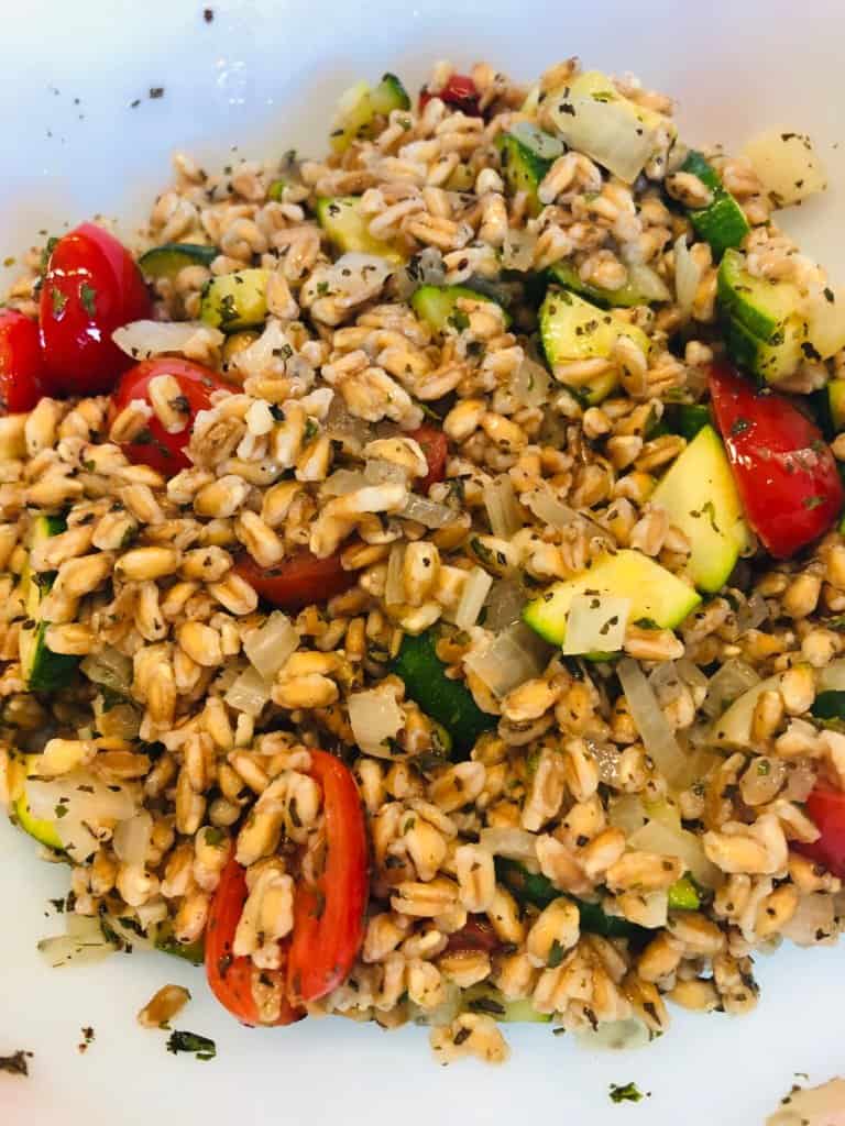 A farro salad with zucchini and tomatoes.
