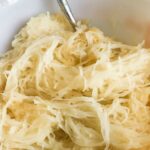 Cooked spaghetti squash in a bowl.