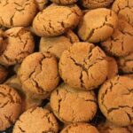 Old fashioned ginger snap cookies in a stack.