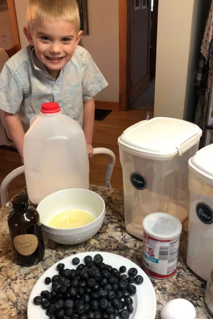 Wet and dry ingredients coming together to make mini blueberry muffins.