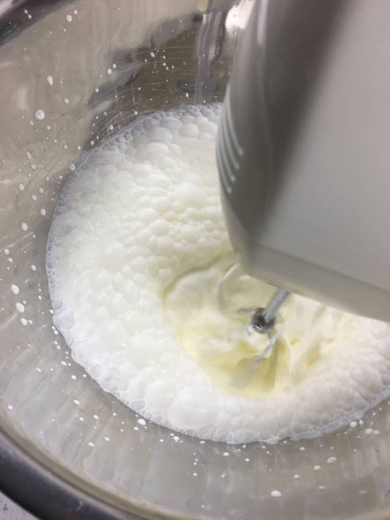 whipping cream in a mixer bowl