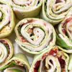 Turkey pinwheels with cranberry sauce, cut into bite size pieces.
