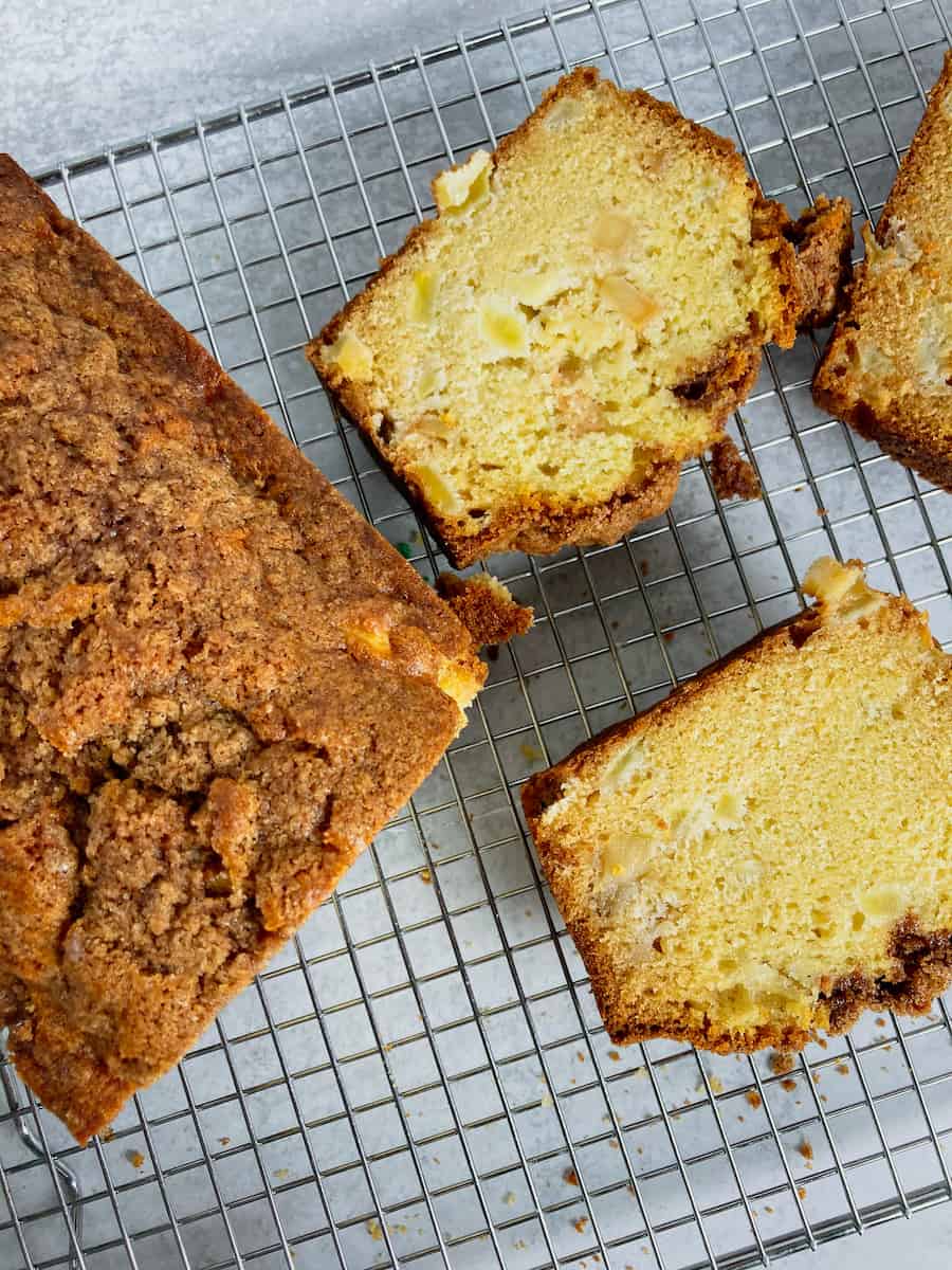 Slices of Dutch apple bread on a cooling rack.