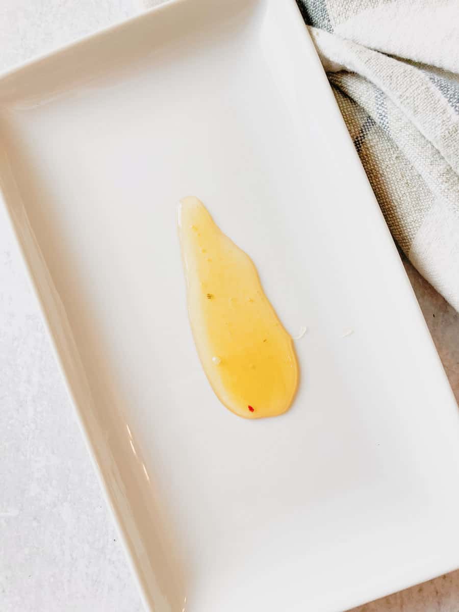 Honey drizzled on a rectangular serving platter.