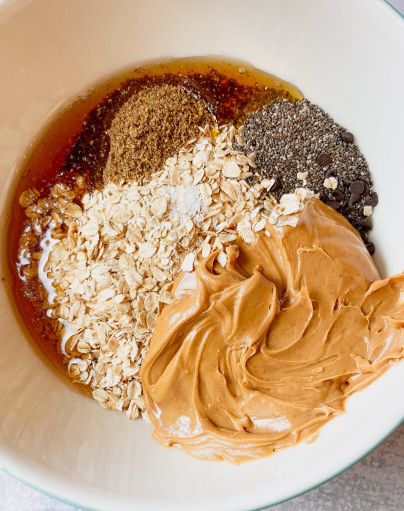 Peanut butter, chia seeds, old-fashioned oats, honey in a bowl.