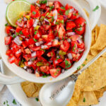 mild pico de gallo in a bowl with chips