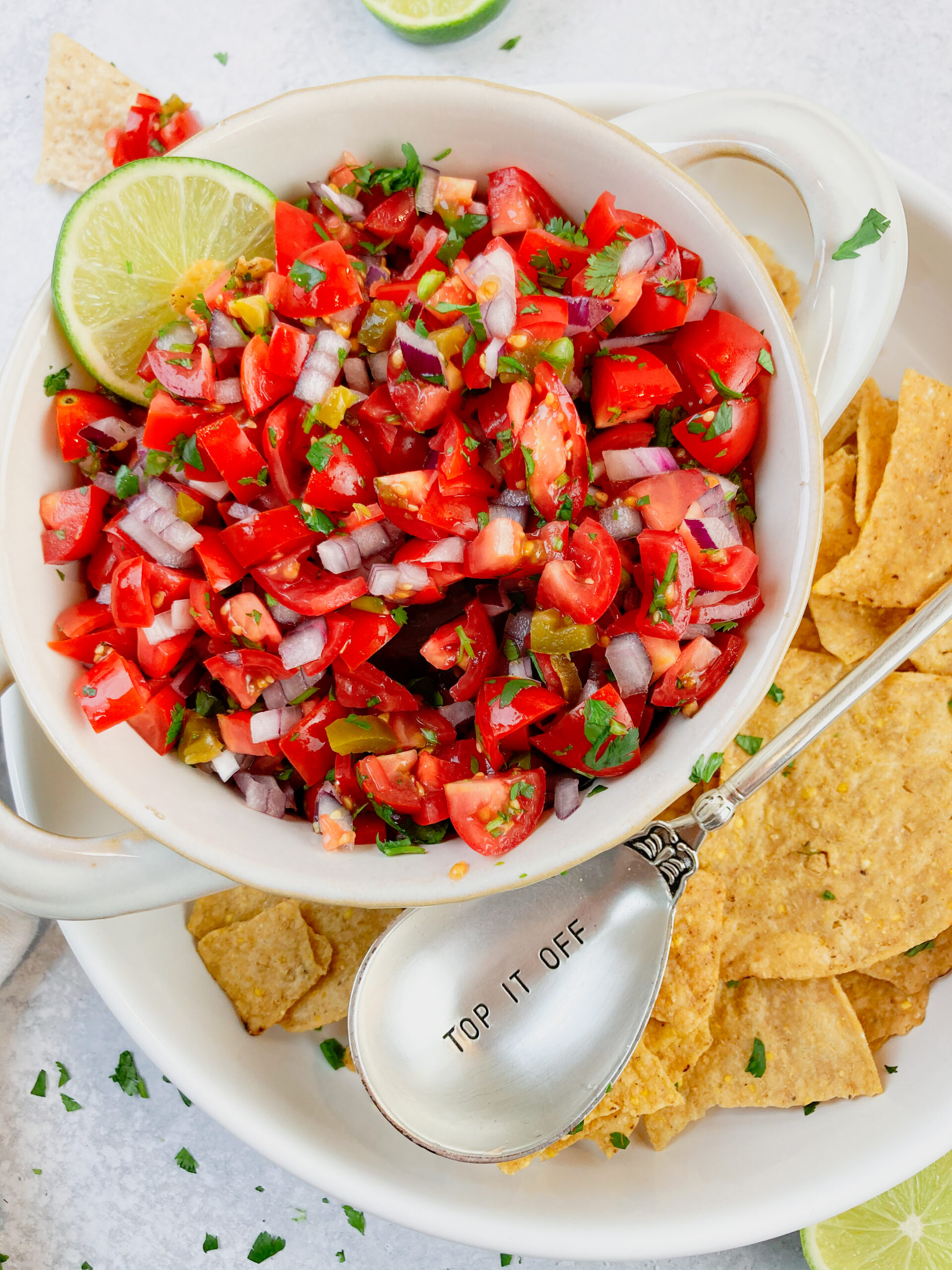 mild pico de gallo in a bowl with chips
