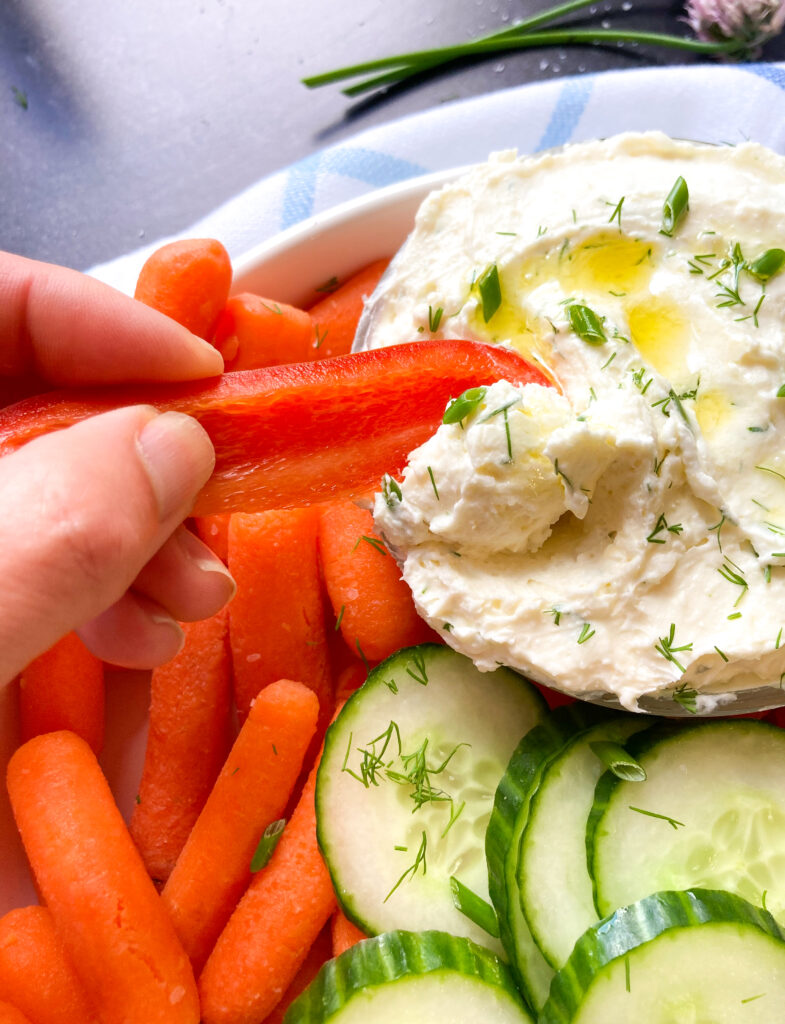 whipped feta dip with red pepper slices and cucumber 