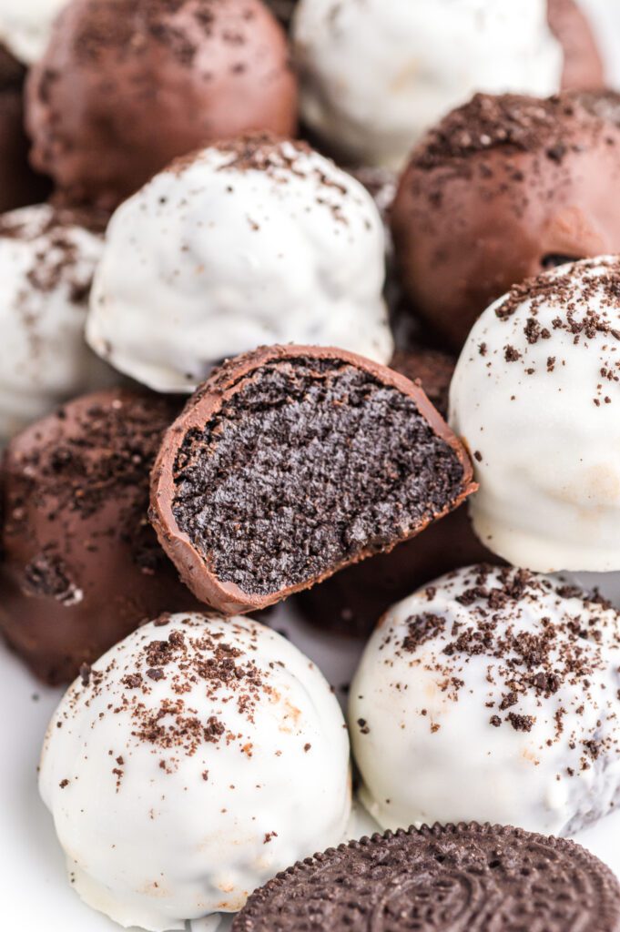 A stack of chocolate covered oreo balls.