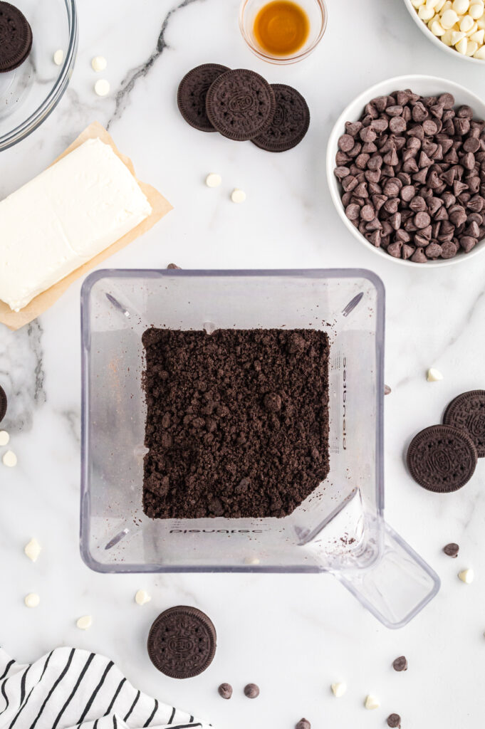 A blender full of crushed oreo cookies.