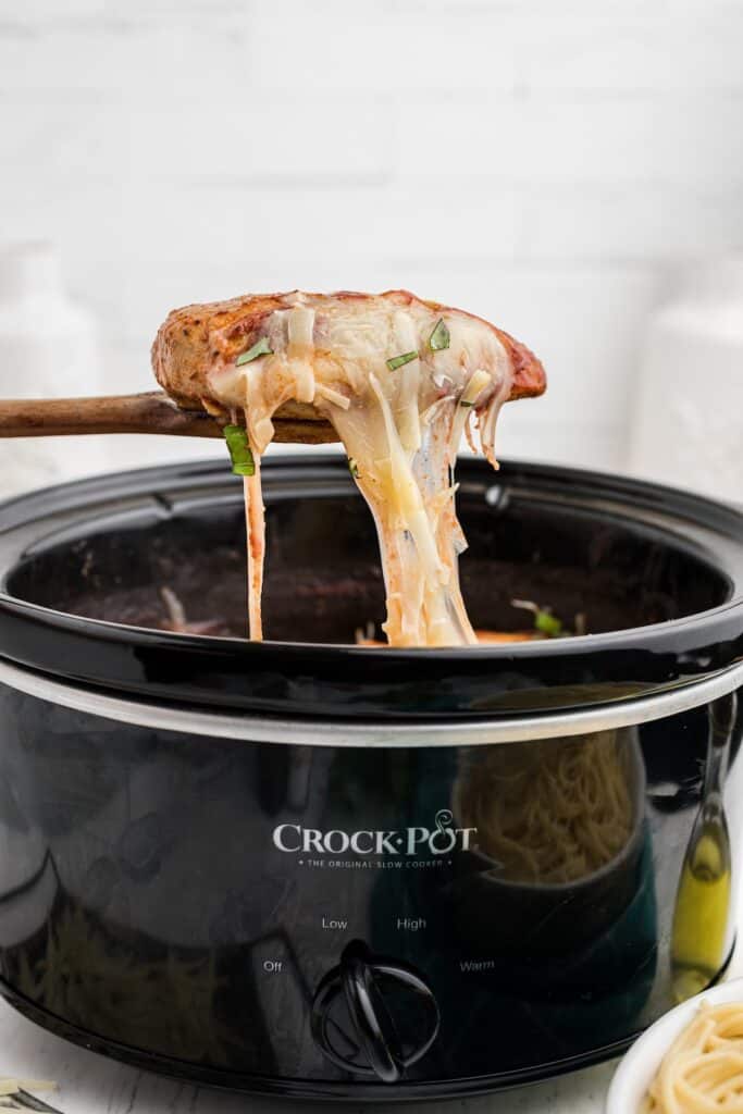 Cheesy chicken parmesan to be served.