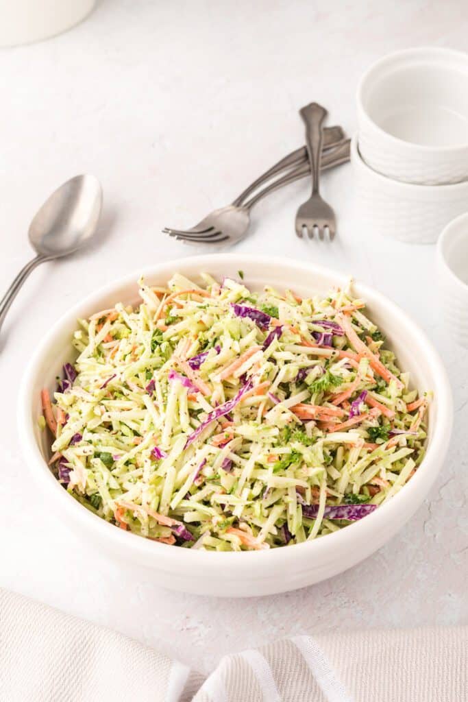Broccoli slaw and cabbage in a bowl.