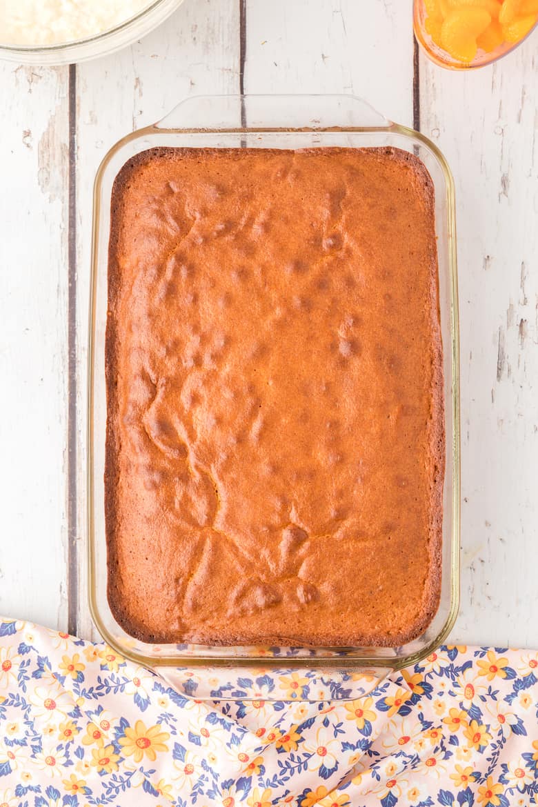 Mandarin orange cake in a 9x13 pan after baking.