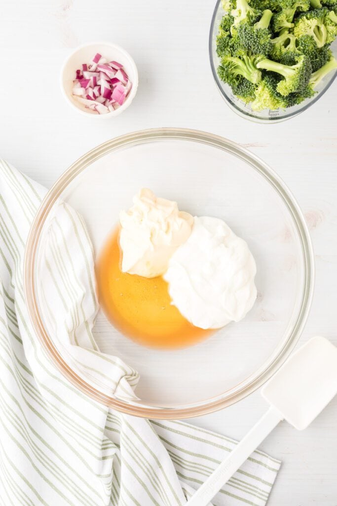 Yogurt, mayonnaise, vinegar and honey in a medium bowl.