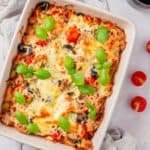 A tuna casserole with tomato sauce and cheese.