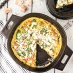 A frittata with spinach, mushrooms and feta cheese.