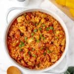 Homemade chicken and sausage jambalaya in a rustic pot.