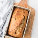 A bread pan filled with banana bread made with coffee.