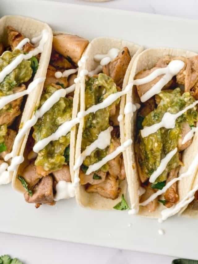 Pollo asado taco platter with sour cream.