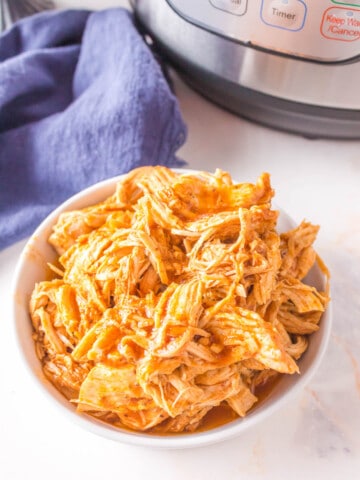 Shredded BBQ Chicken in a bowl by the Instant Pot