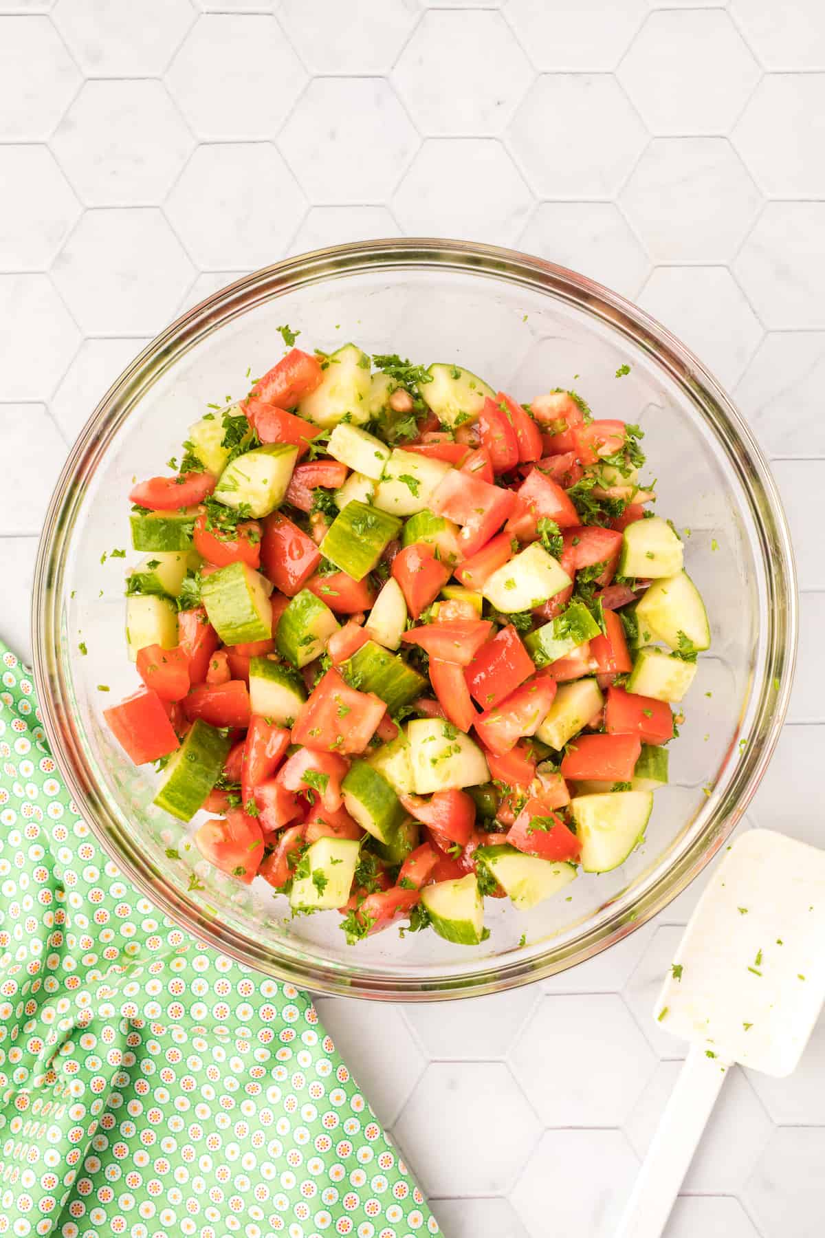 Cucumber tomato salad in a serving bowl.