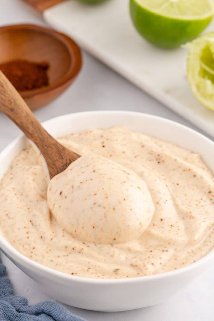 A wooden spoonful of chipotle mayo.