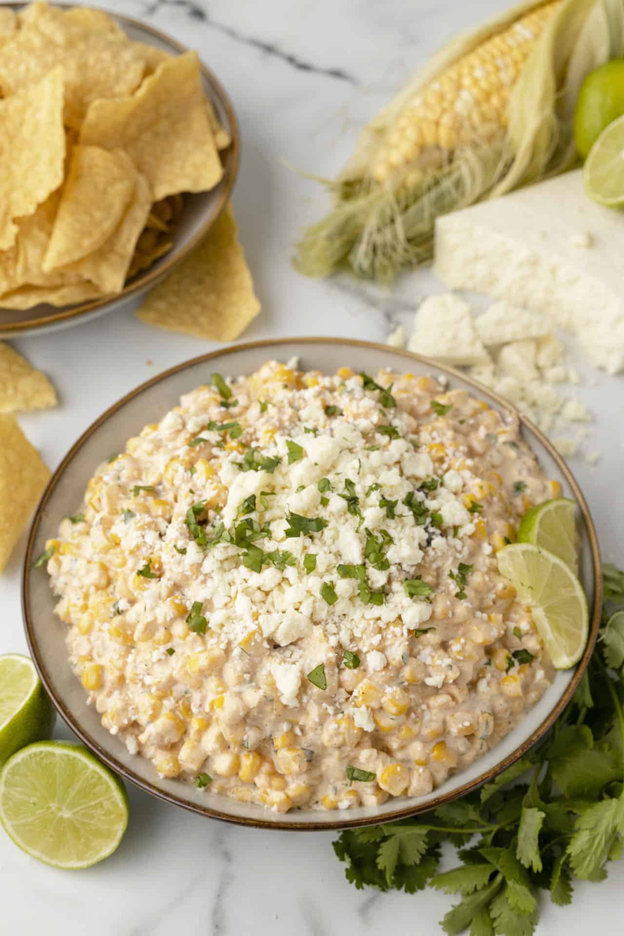 Mexican street corn dip in a serving bowl.