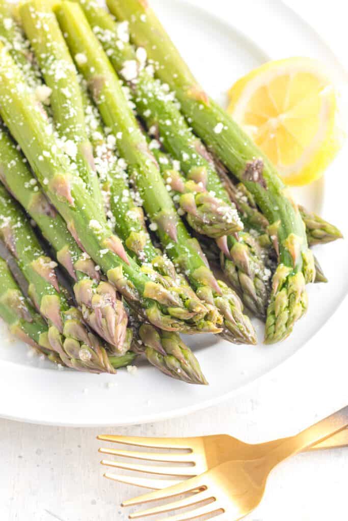 Tender asparagus plated with lemon and parmesan.