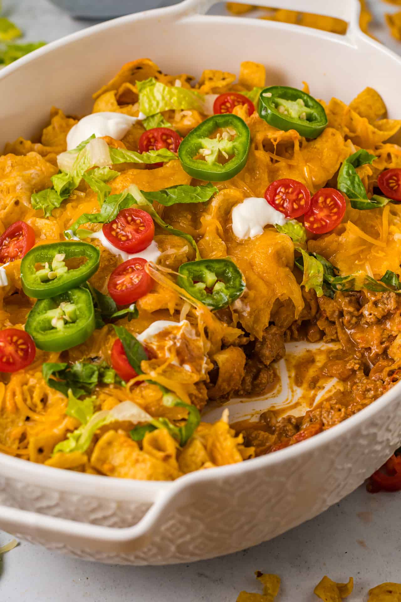 A taco casserole with frito chips.
