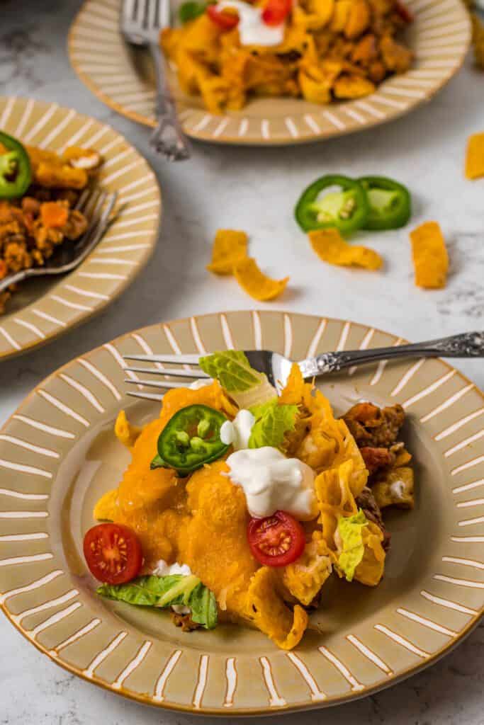 Plated walking taco casserole in individual portions.