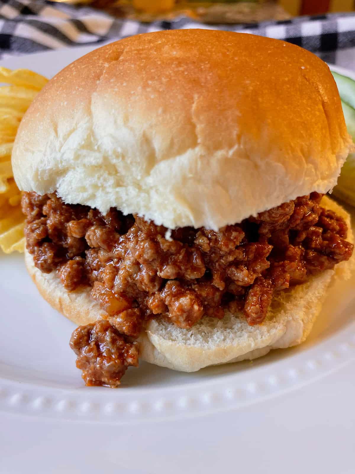 Sloppy Joe Sandwich on a bun with potato chips