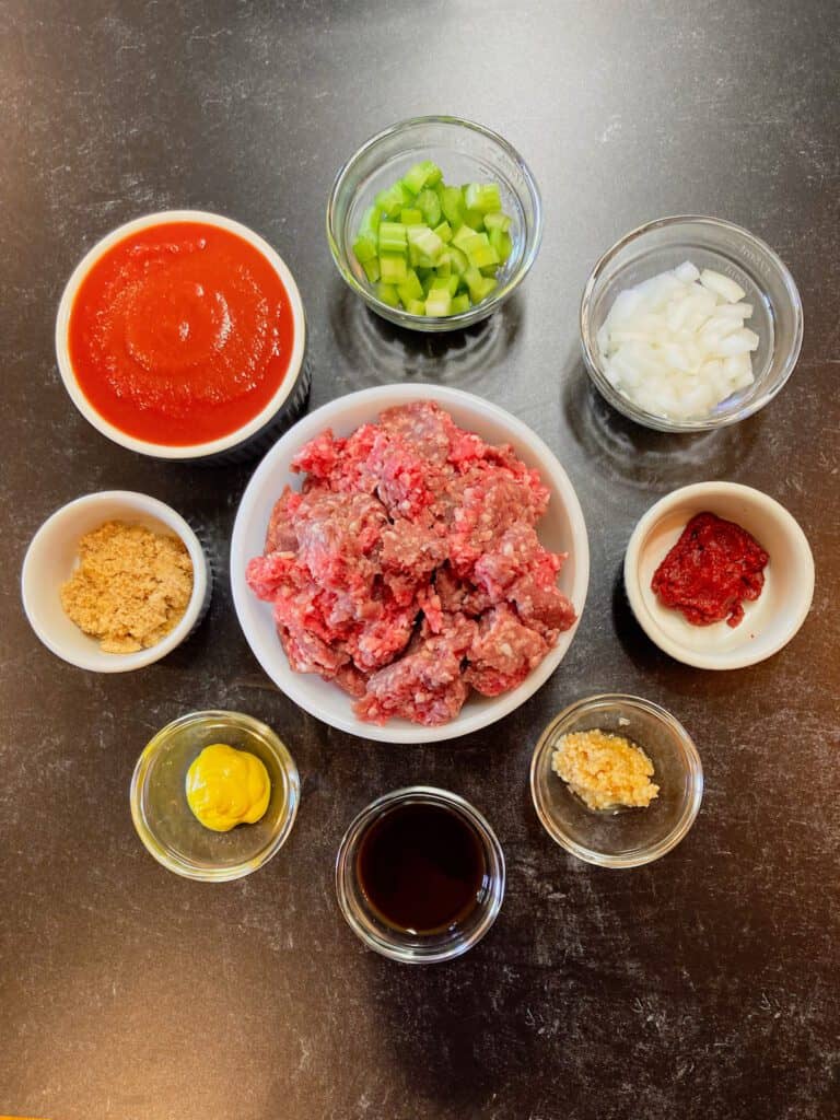 Ground beef and sloppy joe ingredients on a countertop.