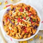 Spiral shaped pasta topped with tortilla strips.