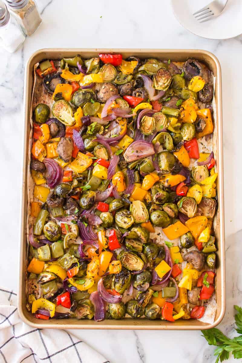 A sheet pan full of chopped and roasted veggies.