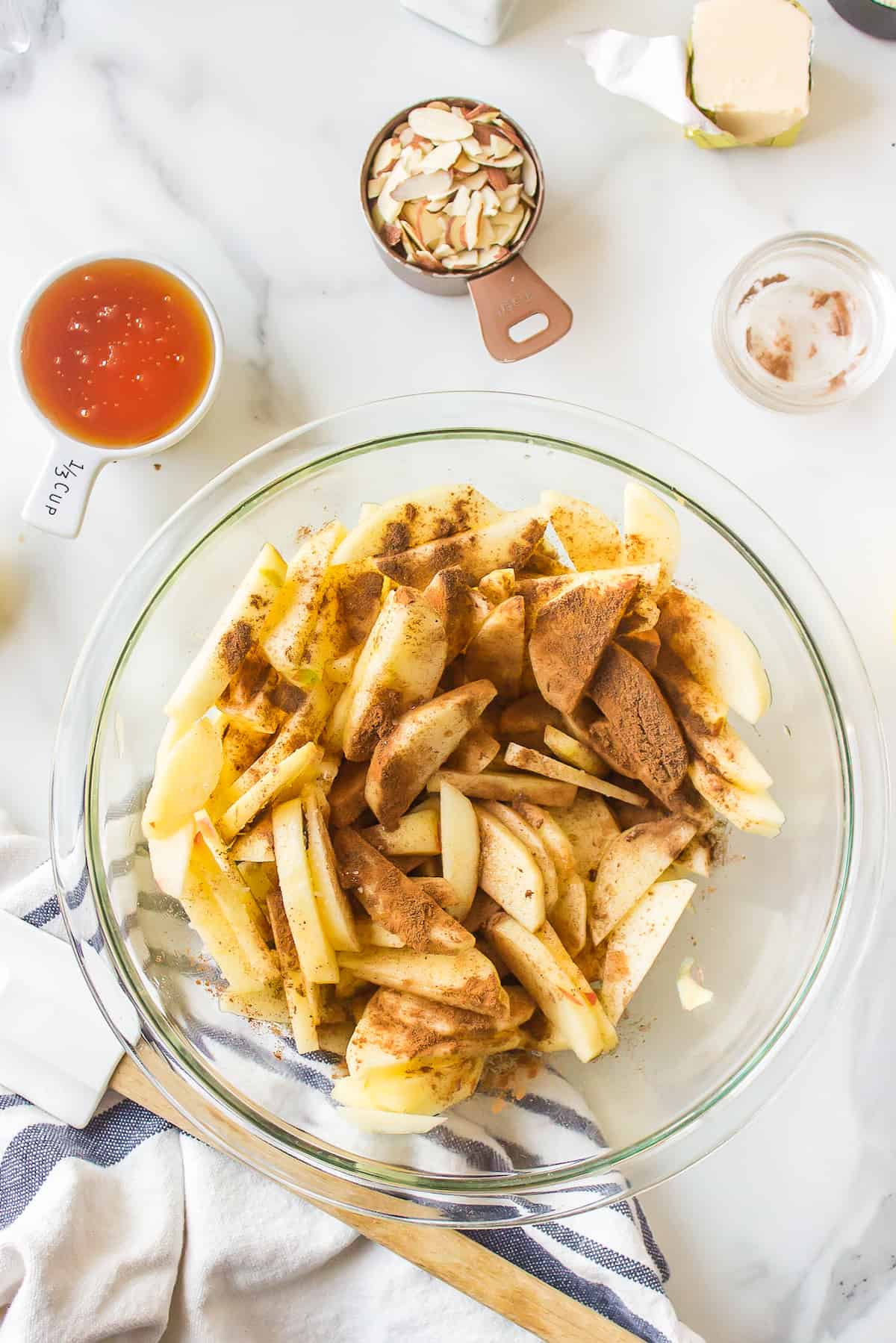 Apple slices dusted with ground cinnamon.