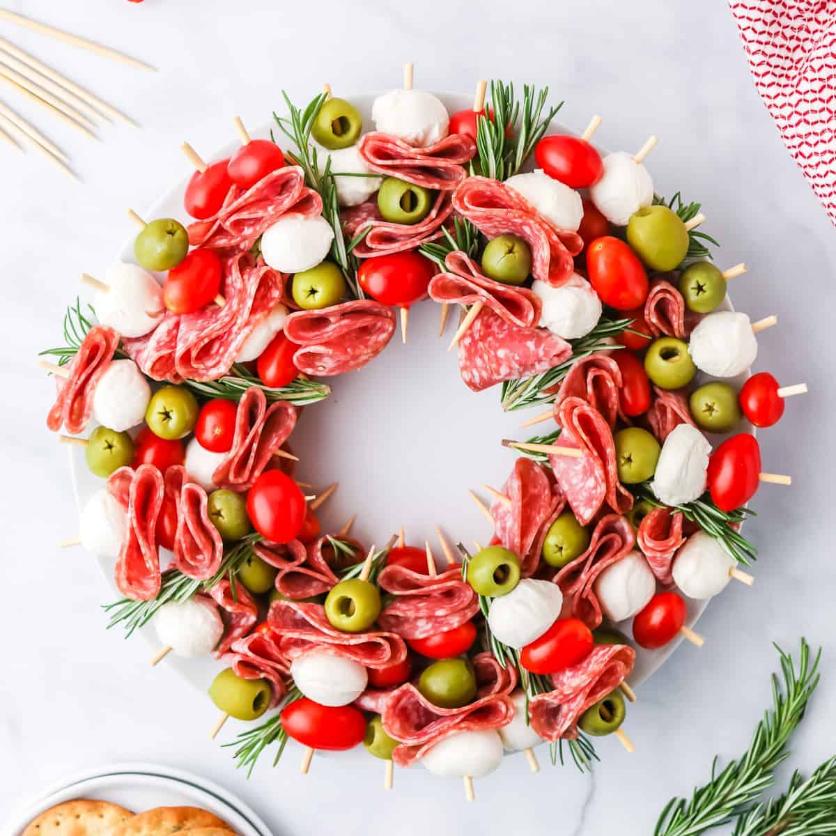 Salami, tomato, mozzarella and olive appetizer wreath.
