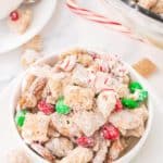 Chocolate peanut butter chex mix with candy canes and m&ms.