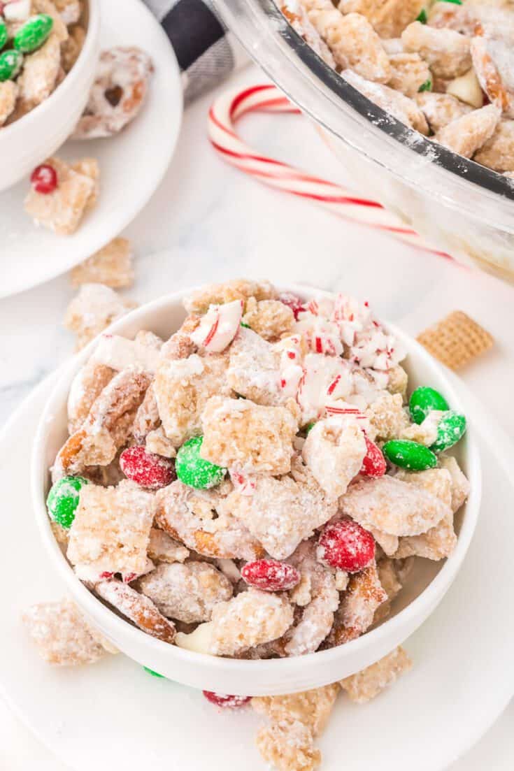 Chocolate peanut butter chex mix with candy canes and m&ms.