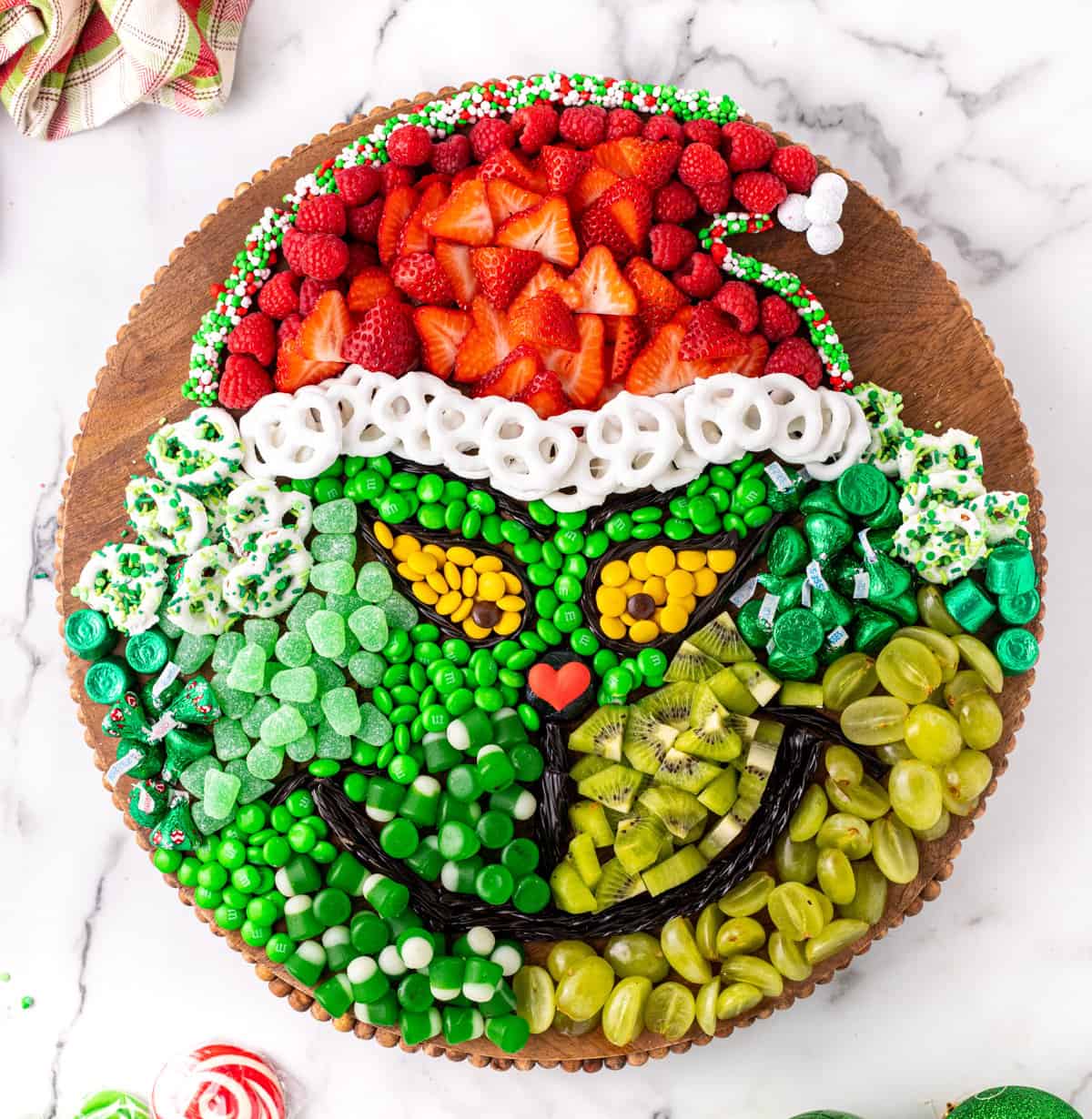 Candy board in the shape of the Grinch.