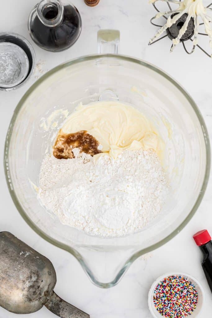 Butter, cornstarch, flour and vanilla extract in a mixing bowl.