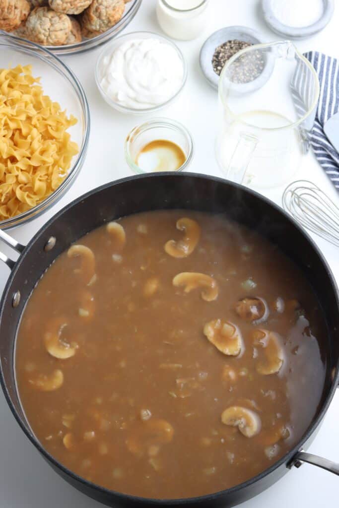 Brown gravy in a pan.