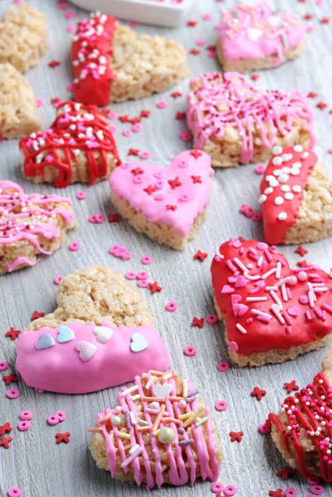 Frosted heart shaped rice krispie treats with x's and o's.