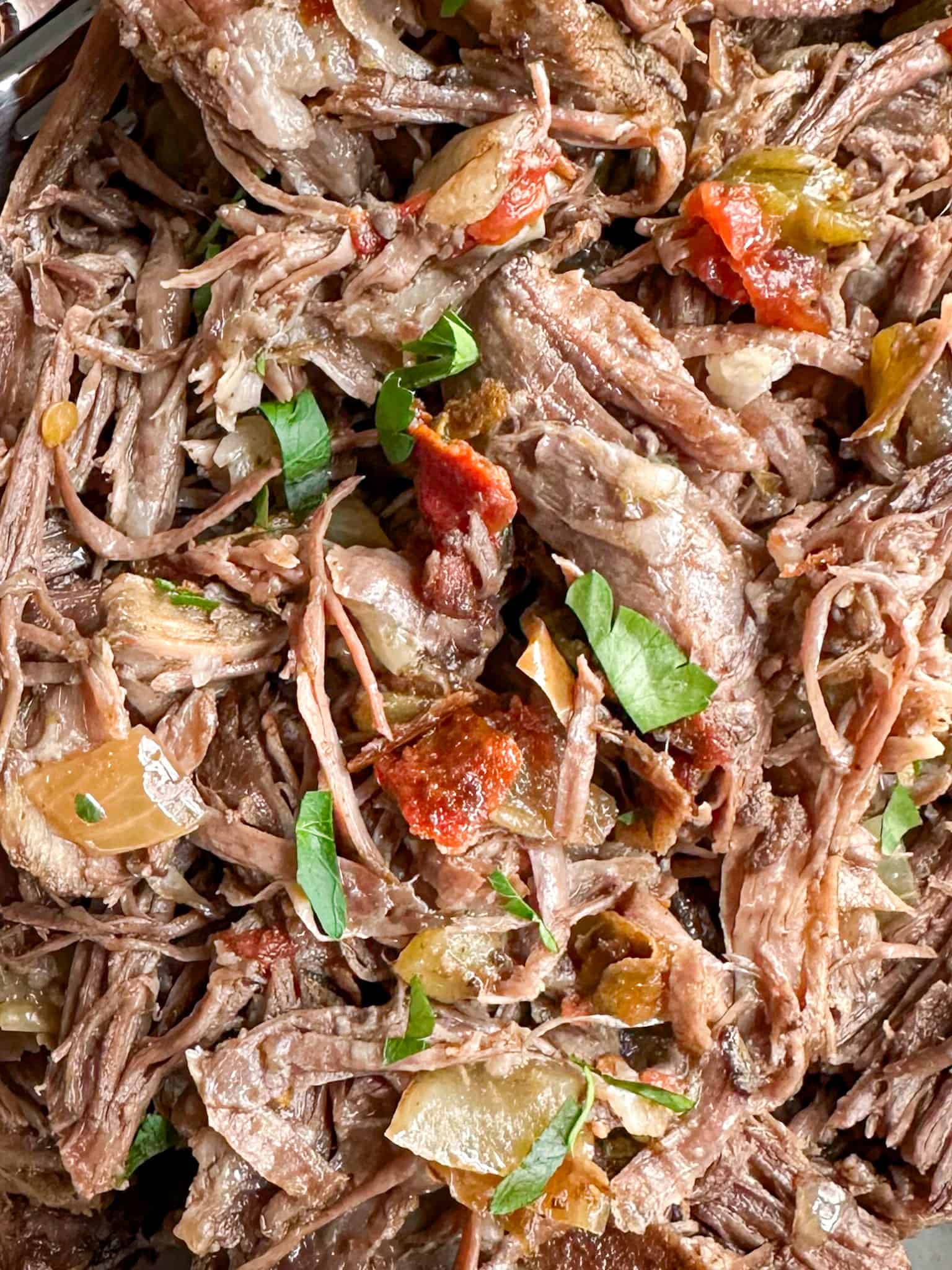 Juicy crockpot Mexican shredded beef ready for serving.