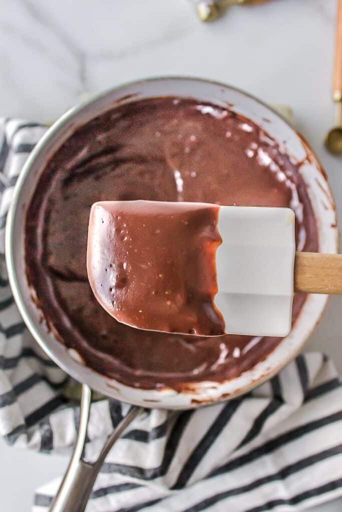 Chocolate pie filling coating a rubber spatula.