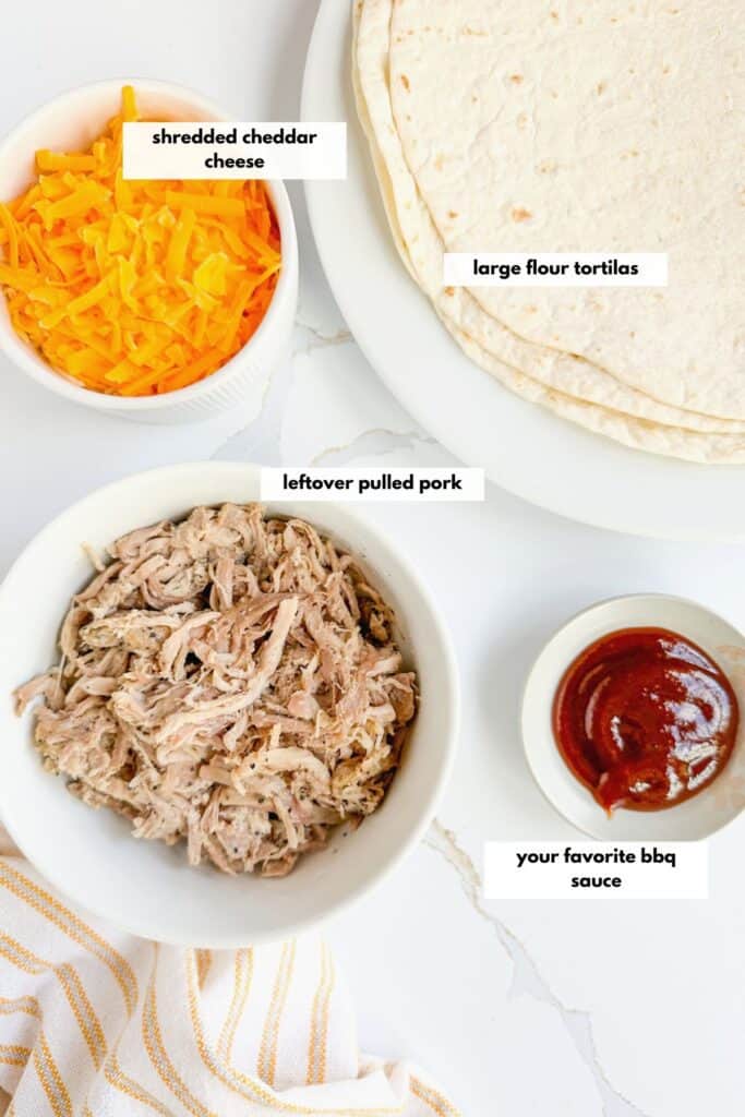 Ingredients to make pulled pork quesadillas are cheese, leftover pulled pork, large flour tortillas and your favorite bbq sauce.
