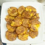 Seasoned air fryer baby potatoes on a plate.