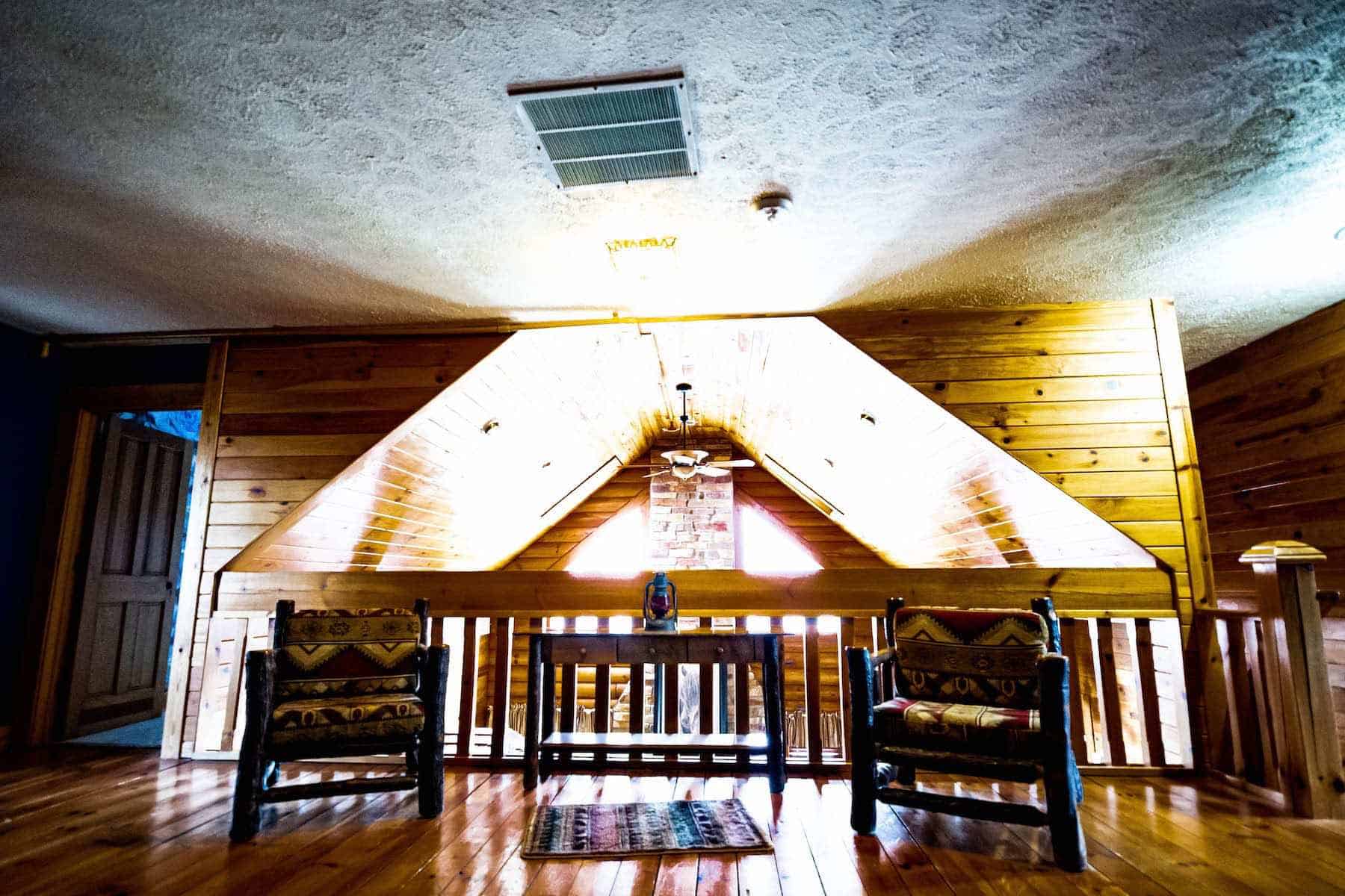 A cozy sitting area in a log cabin.